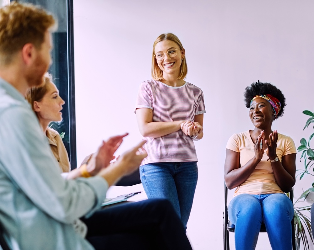 Smiling woman during group therapy in Georgia rehab