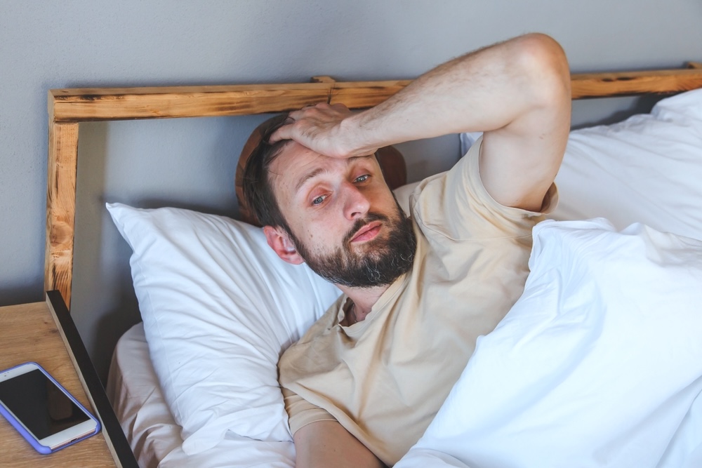 Male adult struggling with alcohol withdrawal symptoms